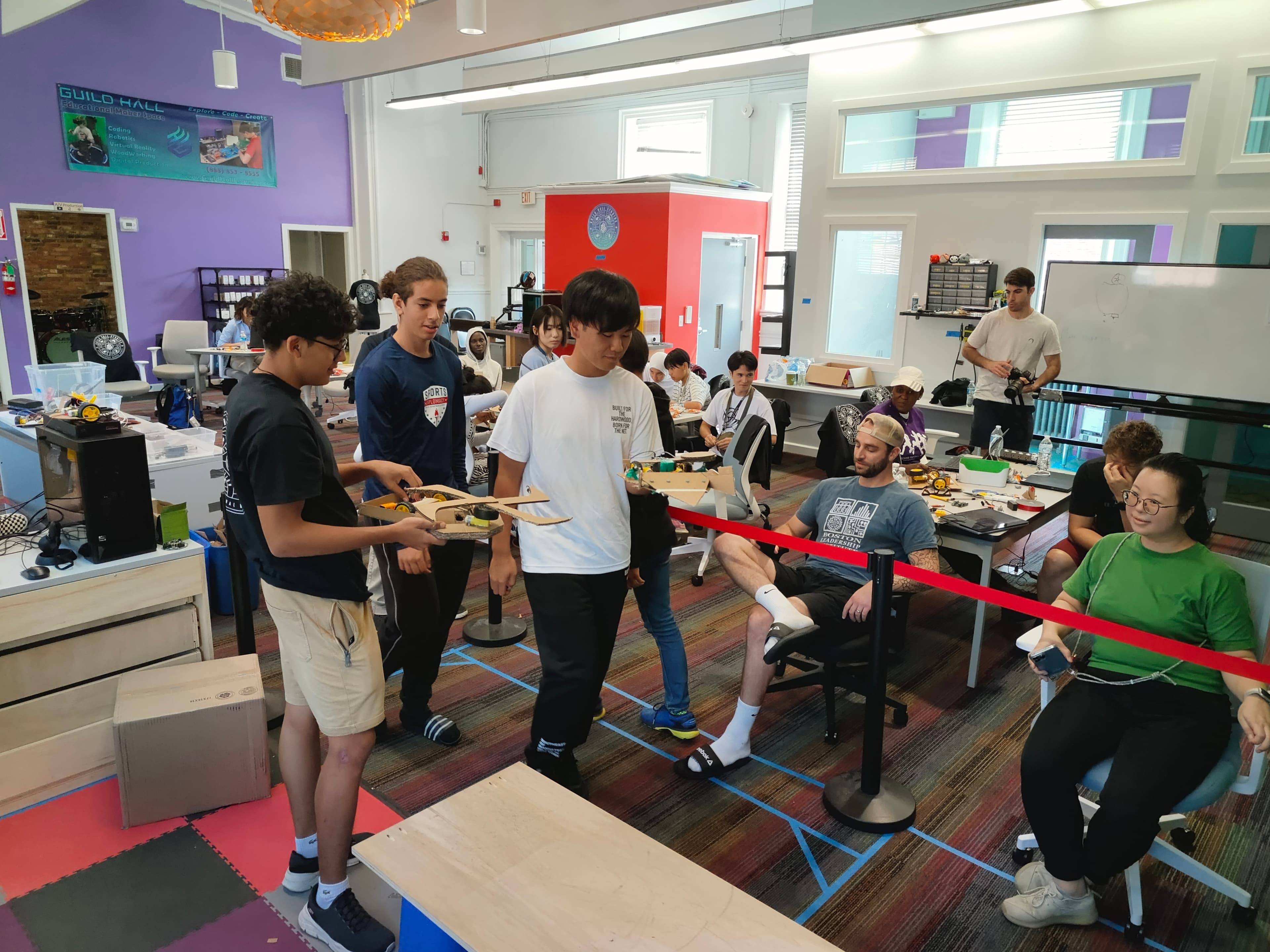 Young makers demonstrate a robot in Guild Hall’s Cambridge studio