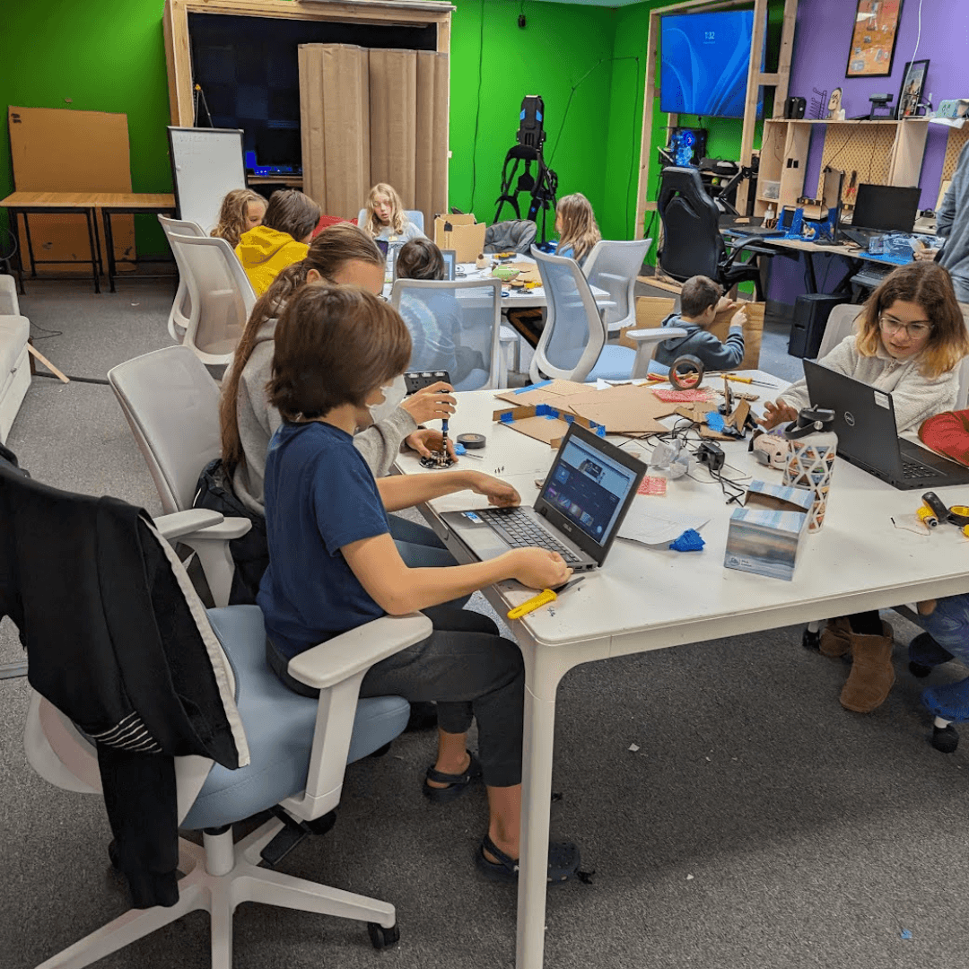 Learners working on computers and physical projects in Guild Hall’s Woburn studio