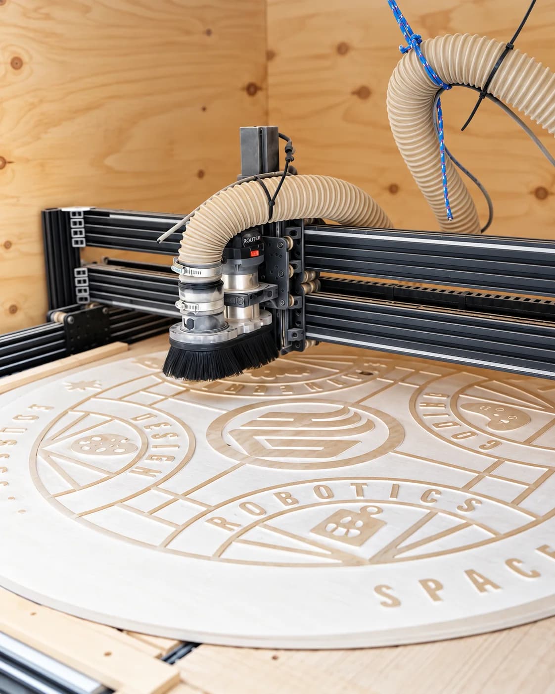 A CNC router cutting circular designs into wood