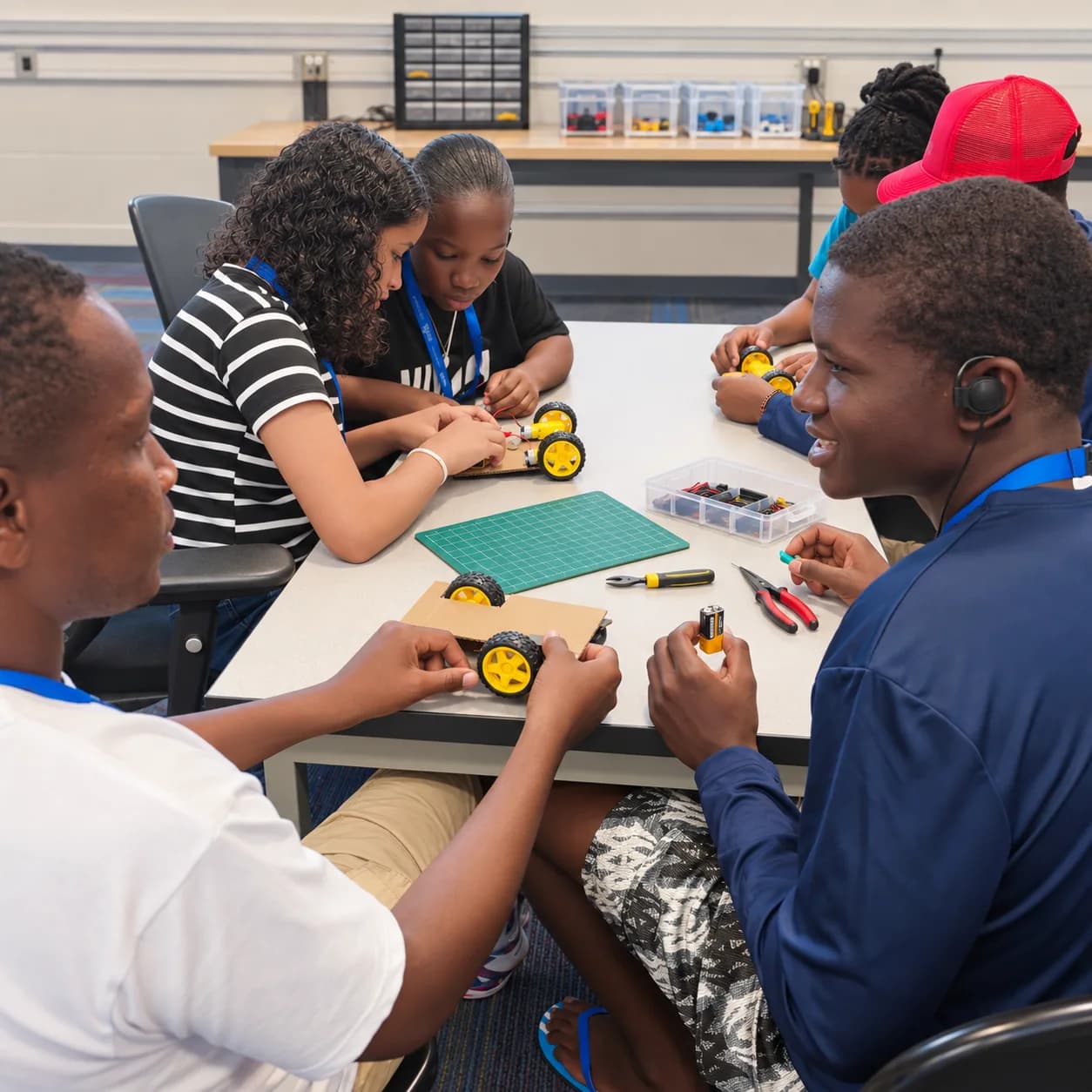 Participants building robots in small teams