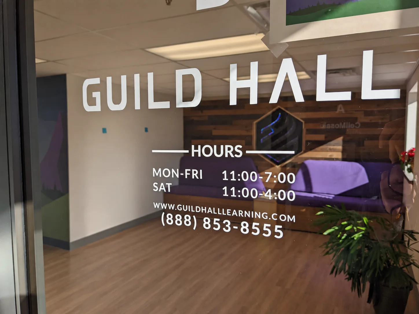 Guild Hall lettering on a glass entrance with a reception area beyond